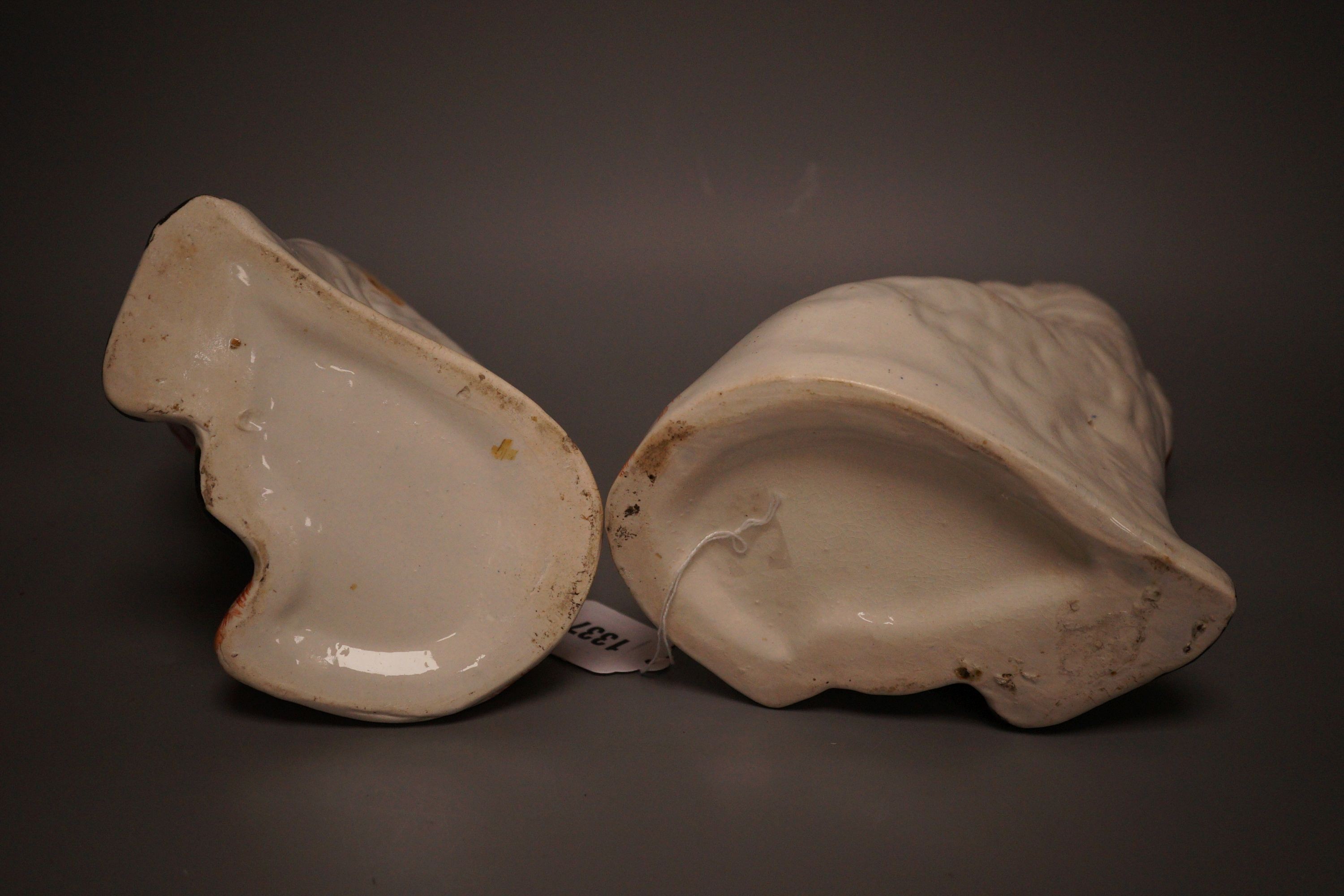 A pair of Staffordshire pottery King Charles spaniel’s, 24cm